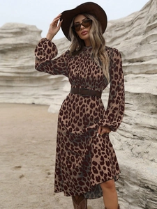 Detail of long sleeve leopard print dress with a high collar and brown faux leather belt