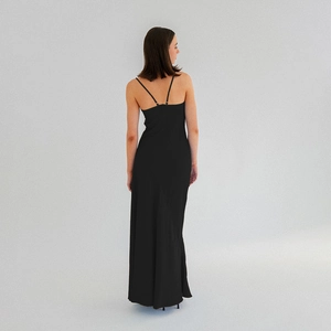 Detail of elegant black backless dress with a V-shaped lace-up tie design on the back