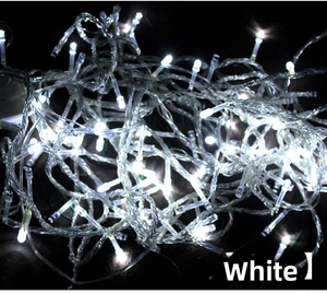 Detailed view of white LED string lights with transparent wire for festive decoration