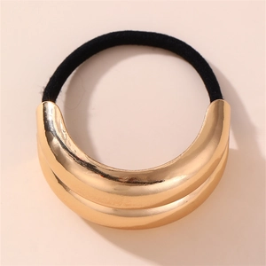 Detail of high-elastic black hair tie with polished gold C-shaped metal buckle accessory