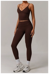 Detailed studio shot of chocolate brown two-piece yoga set with sports bra and leggings