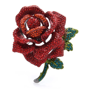 Exquisite rose flower brooch with colorful rhinestones on a clean white background