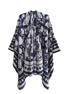 Close-up of blue and white knit texture with ink wash jacquard pattern on shawl