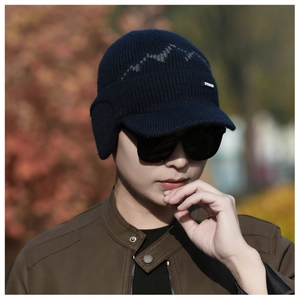 Close-up of men's winter navy knit cap with fleece lining and windproof ear protection flaps