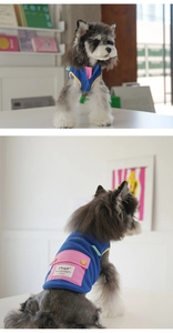 Close-up detail of fleece dog vest featuring zipper closure and contrast cargo pocket