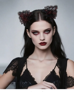 Close-up detail of gothic black lace headband with red bloodstain effect for cosplay