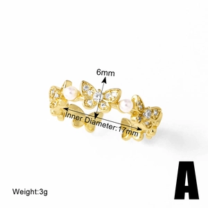 Detail shot of adjustable gold butterfly ring with pearls and 6mm height dimension label