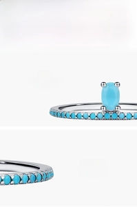 Detail of S925 sterling silver ring featuring an oval turquoise and micro-pave stones