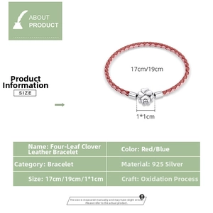 Detail view of S925 silver four-leaf clover pendant on a braided leather cord bracelet