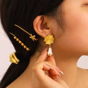 18K gold plated titanium steel pearl drop earrings and matching clips set on a model