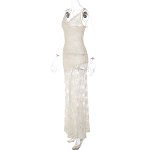 Close-up of elegant white floral lace fabric and sheer details on a sexy V-neck maxi dress