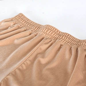 Detail of the elastic waistband on soft velvet champagne lounge shorts with stitching