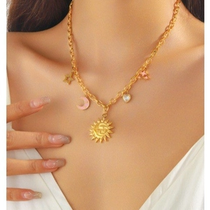 Retro 18K gold plated chunky chain necklace with sun moon and star charms worn by model