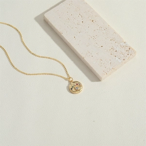 14K gold plated necklace featuring a round evil eye pendant with multi-color zircon stones