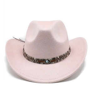 Detail view of pink suede cowboy hat featuring a bohemian evil eye charm accessory