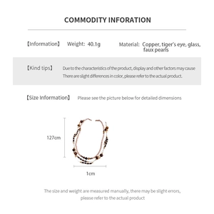 Detail showing vintage tiger eye and pearl necklace specs with 127cm length data