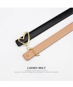 Detail of slim leather belts for women with gold heart buckles in black and beige