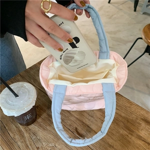 Internal view of quilted heart pattern tote bag showing storage space for daily items