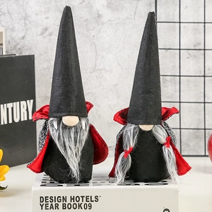 Set of two Halloween vampire gnomes with black hats and red capes for festive desktop decor