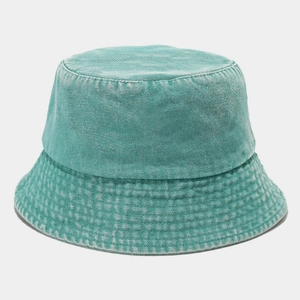 Detail of mint green washed denim bucket hat showing vintage fabric texture and stitching