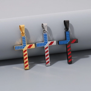Detailed view of American flag cross pendants in gold, silver, and black enamel finishes
