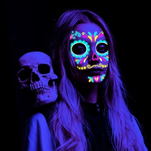 Fluorescent Day of the Dead face tattoo with skull prop for Halloween neon party neon look
