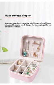 Pink PU leather jewelry organizer showing necklace hooks and ring storage slots