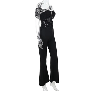 Side view of lace off-shoulder jumpsuit with metal ring and rivet details on white background