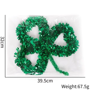 Detailed view of St. Patrick's Day green clover tinsel garland with 39.5cm dimensions