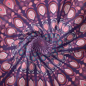 Detail of bohemian mandala tapestry fabric showing purple paisley patterns and soft silk texture