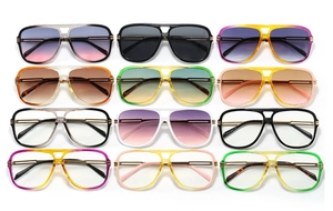 Flat lay of retro aviator square sunglasses in multiple frame colors and gradient lenses