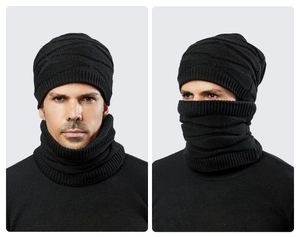Detail of black winter knit hat and neck warmer set with thick fleece lining texture