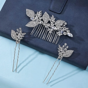 Detailed view of silver leaf floral hair comb and pins with sparkling rhinestones