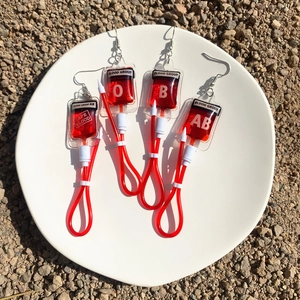 Harajuku style red blood bag earrings for women featuring O, B, and AB blood group labels