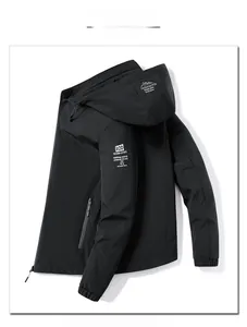 Detail of men's black fleece jacket featuring adjustable hood and zip pocket detail