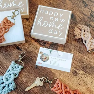 Detail of colorful macrame keychains in various colors with engraved gift boxes