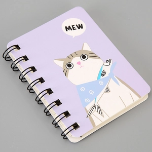 Detail of A7 spiral notebook featuring a cute lavender cartoon cat cover design