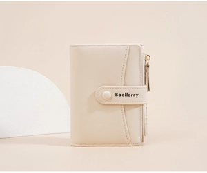 Close-up of cream leather wallet featuring side zipper and secure snap button closure