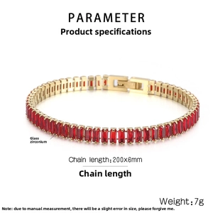 Macro detail of 6mm 18K gold-plated tennis bracelet with rectangular red zircon inlay