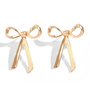 Minimalist golden bow earrings with polished ribbon knot design for women on white background