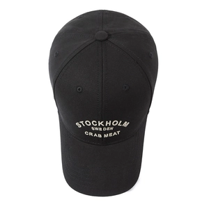 Classic black cotton baseball cap with white Stockholm Sweden embroidery in a top-down view