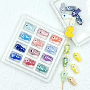 Colorful ceramic fish beads for DIY jewelry making in assorted plated finishes