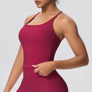 Detail of dark red high-elasticity sports bra with slim straps and matte texture