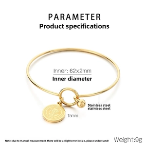 Detail of gold stainless steel bangle with dimensions showing 62x2mm inner diameter