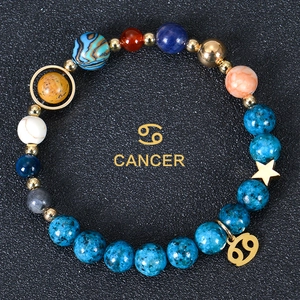 Detailed view of Cancer zodiac bracelet with 8mm natural stones and golden constellation charm