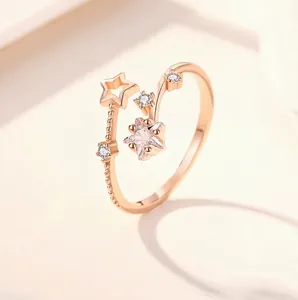 Elegant rose gold star ring with micro-set zircon crystals and adjustable open band design