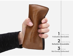 Detail of flexible brown pebble leather wallet showing high durability and folding resistance