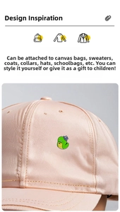 Detail of green snake enamel pin with blue hat on a pink satin baseball cap