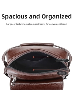 Detail view of brown pebbled leather bag interior with zipper pockets and compartments