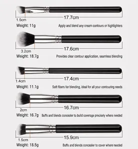 Detail view of 5 professional makeup brushes with black handles and silver ferrules